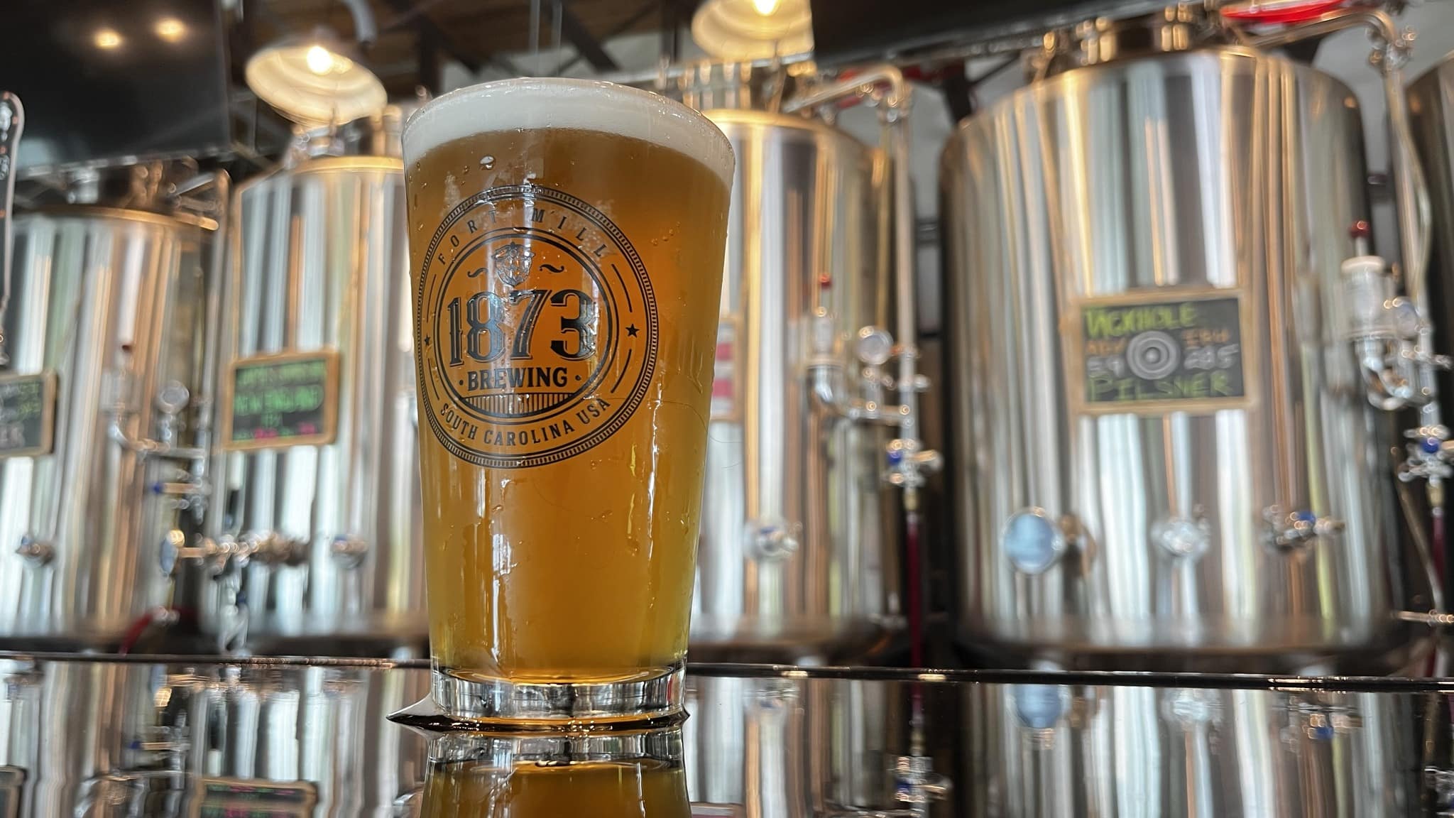 Hoptimizer hero background showing a modern brewery scene